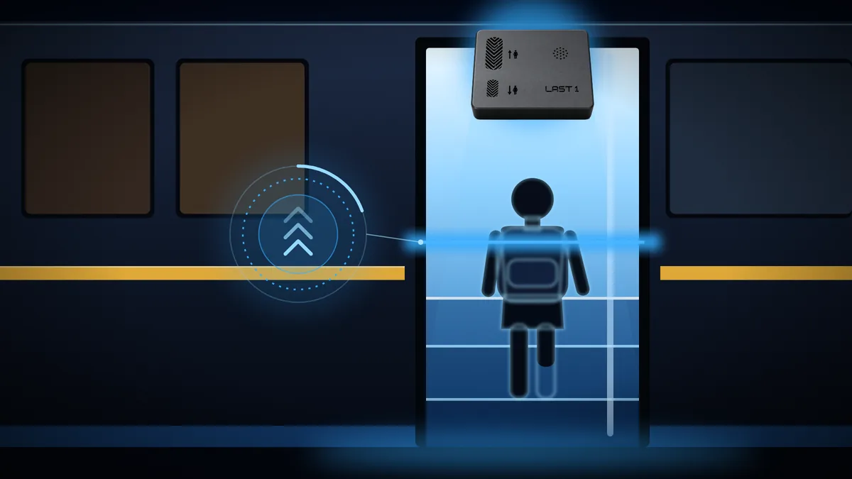 A child steps onto the bus while the Last 1 sensor above the door counts the entry